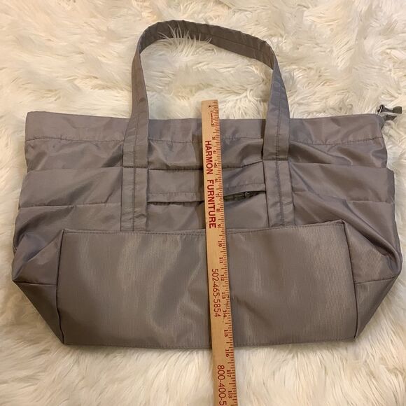 Large gray tote with outside pockets all the way around including one zippered. - Picture 9 of 12